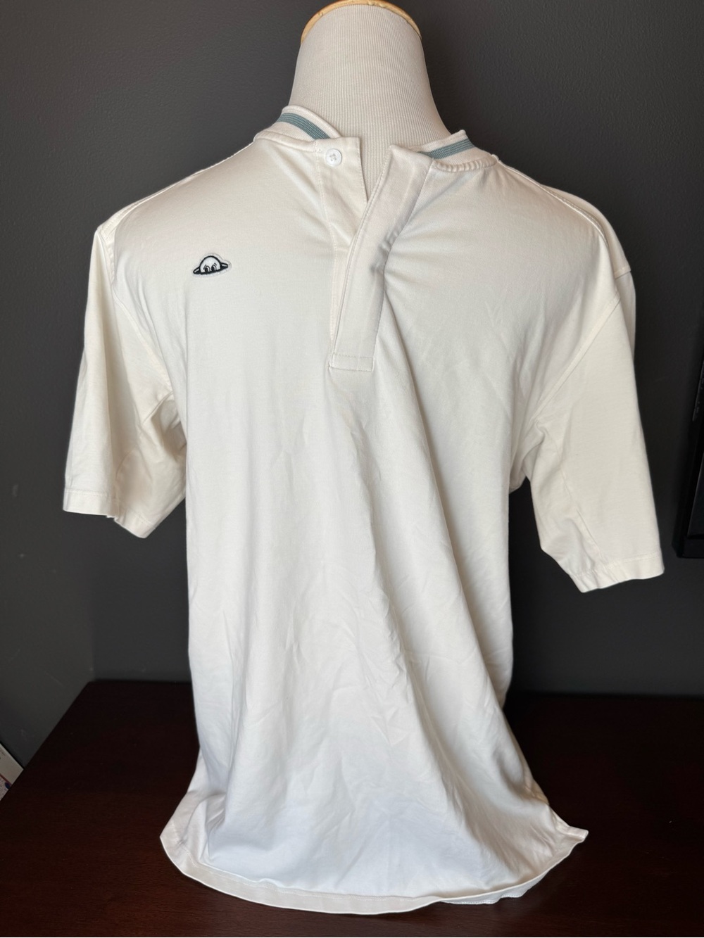 White Short-Sleeve Polo Henley with Subtle Chest Emblem